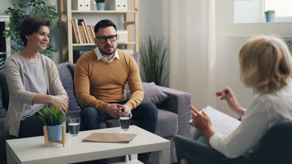 couple in therapy session with counselor — marriage counseling utah at Restore Mental Health